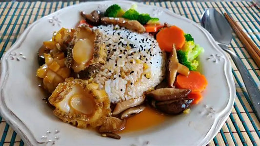 Abulon en su jugo estilo cantones con jengibre